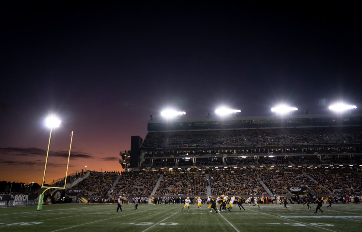 The sun sets during early first-half CFL football game action between the Hamilton Tiger Cats and the Edmonton Eskimos, in Hamilton, Ont., Friday, Oct. 4, 2019.