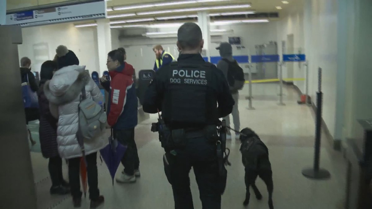 Police enter Vancouver's Waterfront Station after reports of a suspicious package on a SkyTrain on Dec. 21, 2019.