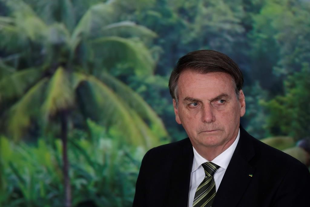 FILE - In this Oct. 1, 2019 file photo, President Jair Bolsonaro attends a ceremony to launch an agro program at the Planalto presidential palace in Brasilia, Brazil.