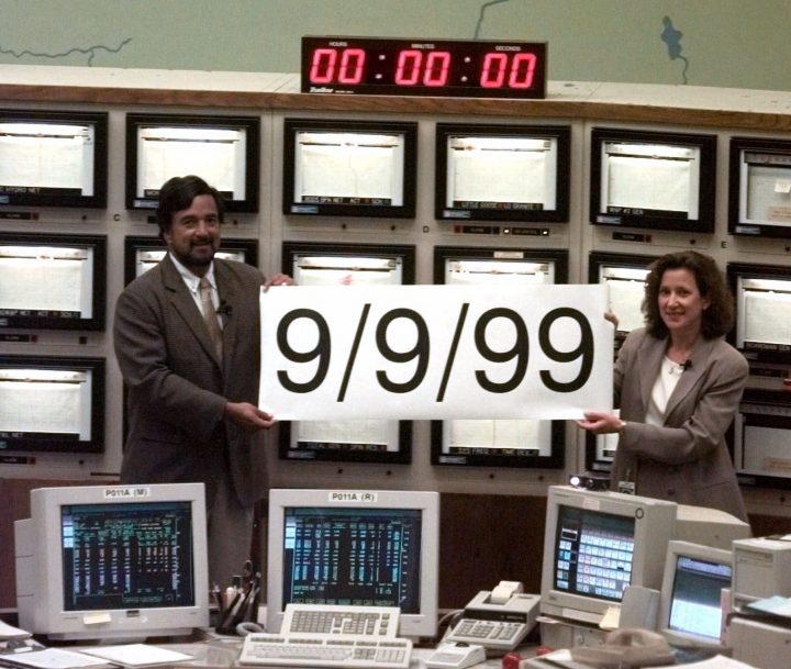 U.S. Department of Energy Secretary Bill Richardson holds up a 9/9/99 sign with Bonneville Power Administration administrator Judi Johansen as the clocks hit midnight during a Y2K drill in the BPA control center in Vancouver, Wash., Wednesday, Sept. 8, 1999.
