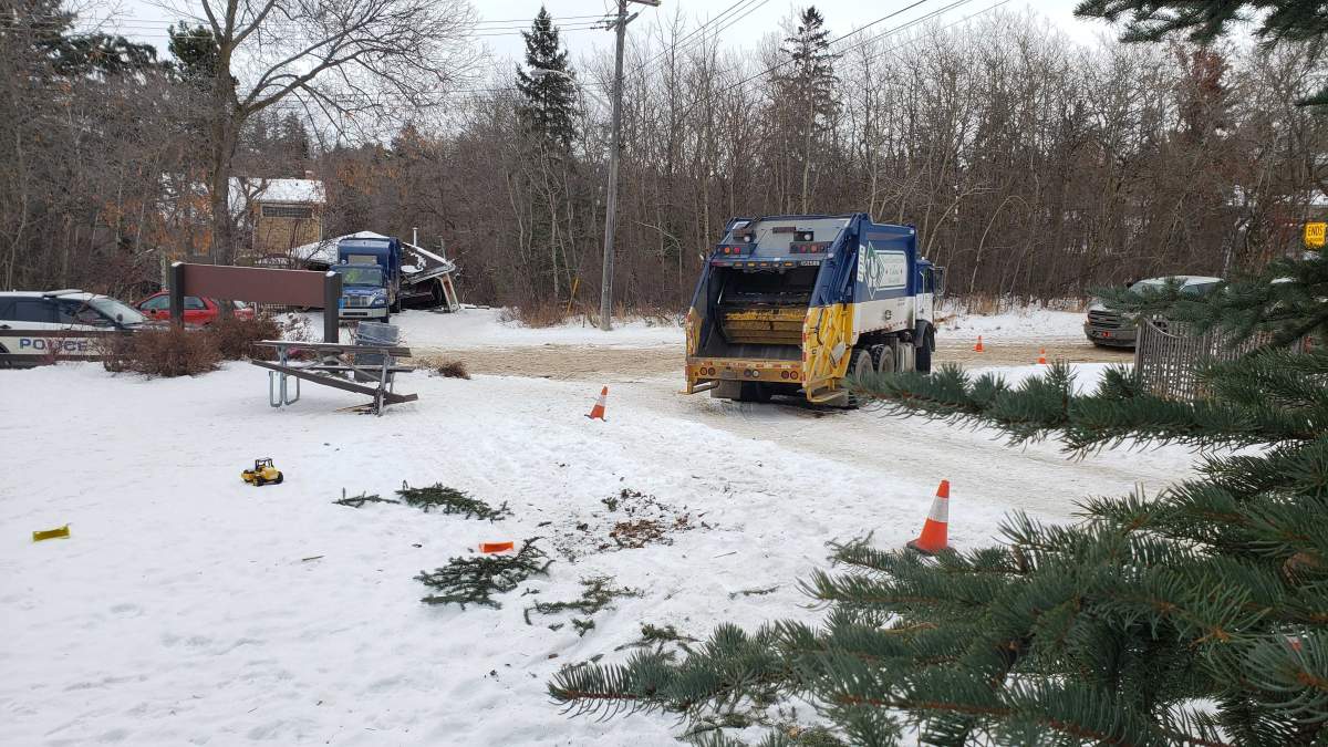 A garbage truck collided with an Edmonton garage on Thursday, Jan. 2, 2020.
