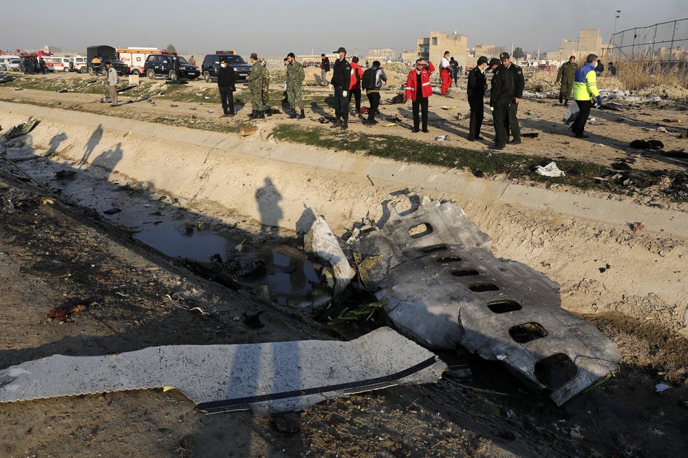 FILE PHOTO: In this Jan. 8, 2020, photo, debris is seen from an Ukrainian plane which crashed as authorities work at the scene in Shahedshahr, southwest of the capital Tehran, Iran.