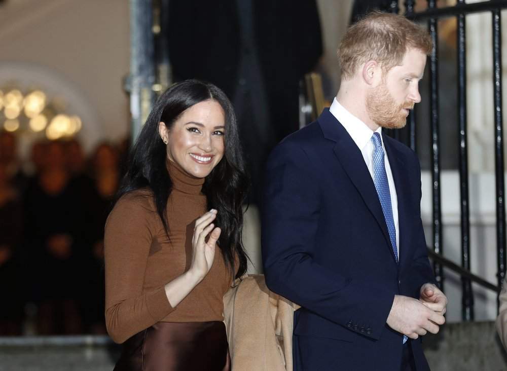 In this Jan. 7, 2020, file photo, Britain's Prince Harry and Meghan, Duchess of Sussex leave after visiting Canada House in London, after their recent stay in Canada. Prince Harry and Meghan Markle are to no longer use their HRH titles and will repay £2.4 million of taxpayer's money spent on renovating their Berkshire home, Buckingham Palace announced Saturday, Jan. 18. 2020. 