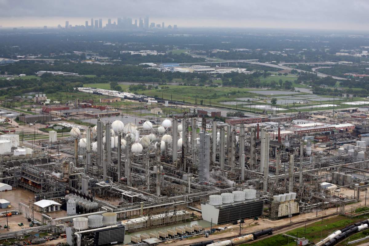 This aerial photo shows the TPC petrochemical plant near downtown Houston, background, on Tuesday, Aug. 29, 2017. 