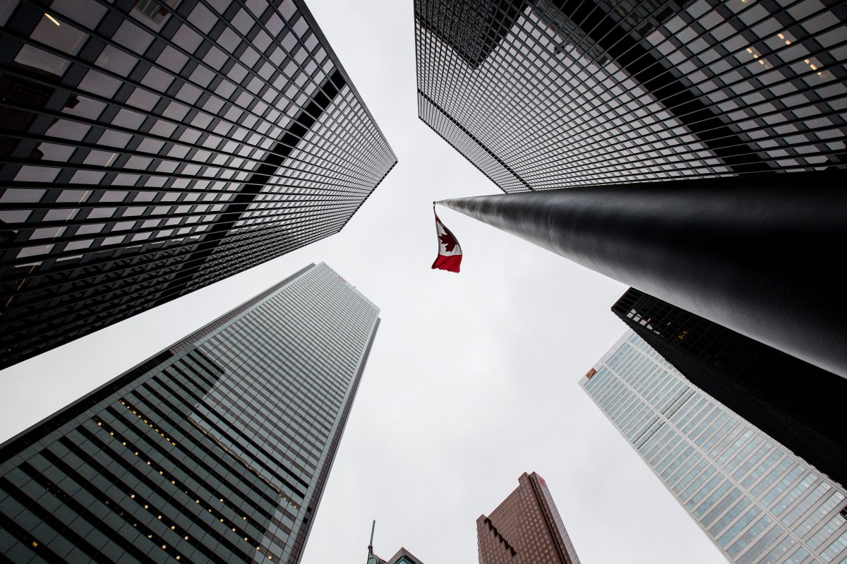 A view of buildings in the financial district of Toronto, Ontario on Sunday, Nov. 26, 2017.  A new report says Canada's top CEOs have already earned as much as the average worker.