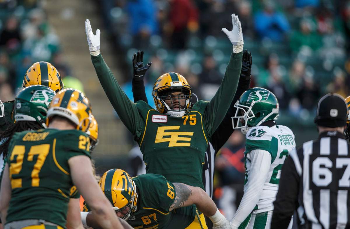 Edmonton Eskimos' Nick Usher (75) celebrates a touchdown against the Saskatchewan Roughriders during first half CFL action in Edmonton, Alta., on Saturday October 26, 2019. 