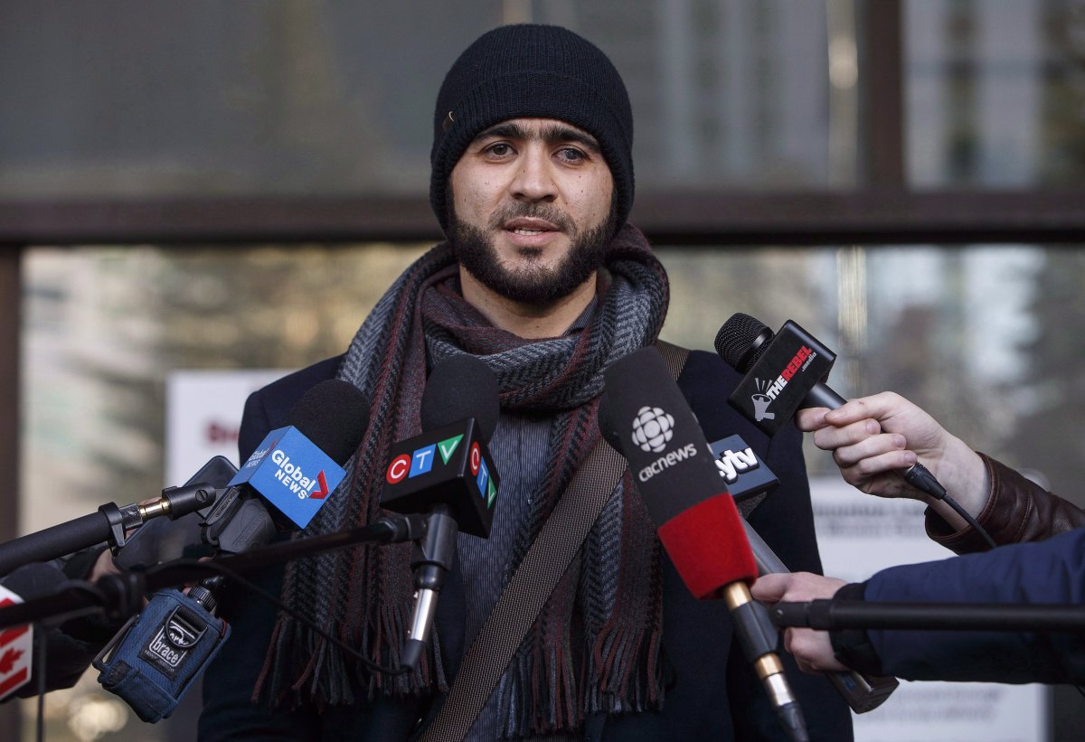 Omar Khadr speaks outside court in Edmonton on December 13, 2018.