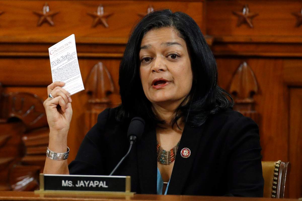 Holding up a copy of the US Constitution, Republican Pramila Jayapal votes to approve the second article of impeachment against President Donald Trump during a House Judiciary Committee meeting, on Capitol Hill in Washington, DC, USA, 13 December 2019.