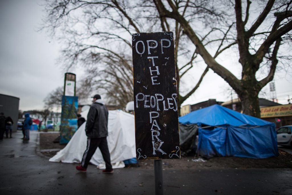 A sign is seen at Oppenheimer Park, the site of a homeless camp, in the Downtown Eastside of Vancouver, on Friday Dec. 13, 2019. 