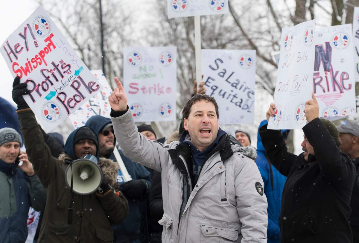 Swissport employees protest near Pierre Elliott Trudeau Airport in Montreal, Tuesday, December 31, 2019. About 108 workers who are responsible for refuelling planes walked off the job on Tuesday morning after they were unable to reach an agreement with Swissport. 