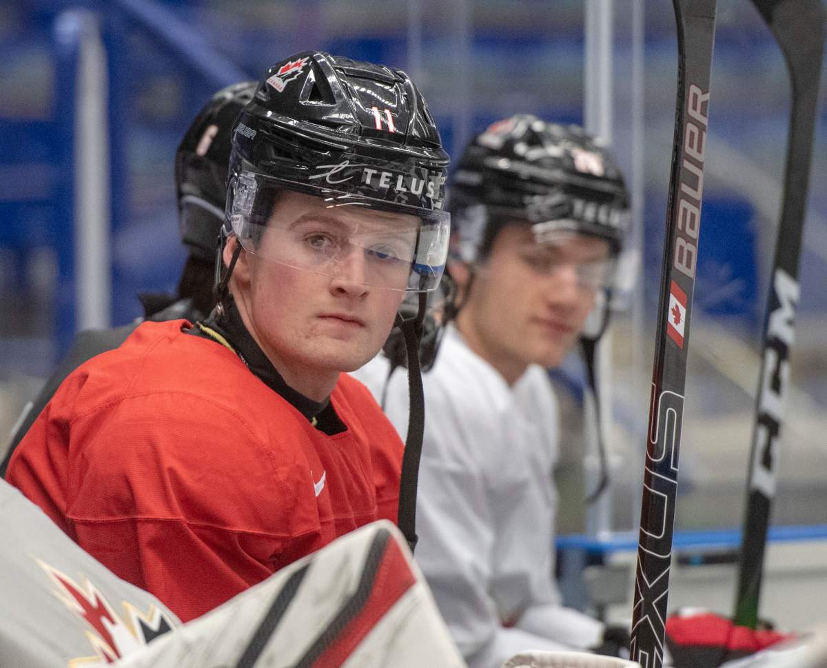Canada's Alexis Lafreniere, who missed the last two games with a knee injury, waits to hit the ice for the team's practice at the World Junior Hockey Championships on Wednesday, January 1, 2020 in Ostrava, Czech Republic.