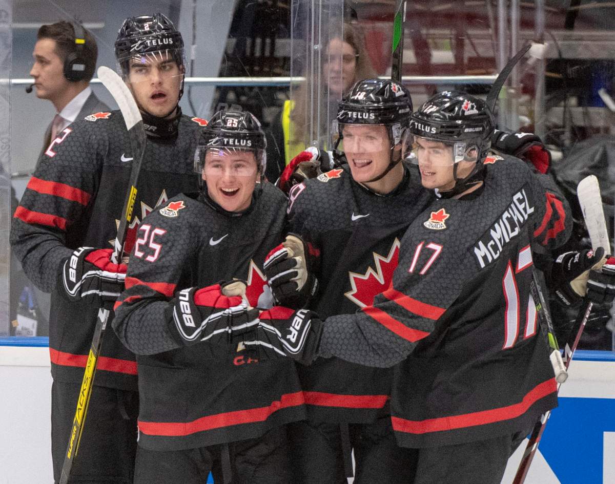 Canada's Ty Dellandrea (18) celebrates with teammates Kevin Bahl (2) Aidan Dudas (25) and Connor McMichael (17) after scoring the fourth goal against Finland during first period semifinal action at the World Junior Hockey Championships on Saturday, January 4, 2020 in Ostrava, Czech Republic. 