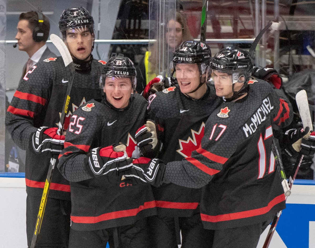 Canada's Ty Dellandrea (18) celebrates with teammates Kevin Bahl (2) Aidan Dudas (25) and Connor McMichael (17) after scoring the fourth goal against Finland during first period semifinal action at the World Junior Hockey Championships on Saturday, January 4, 2020 in Ostrava, Czech Republic. 