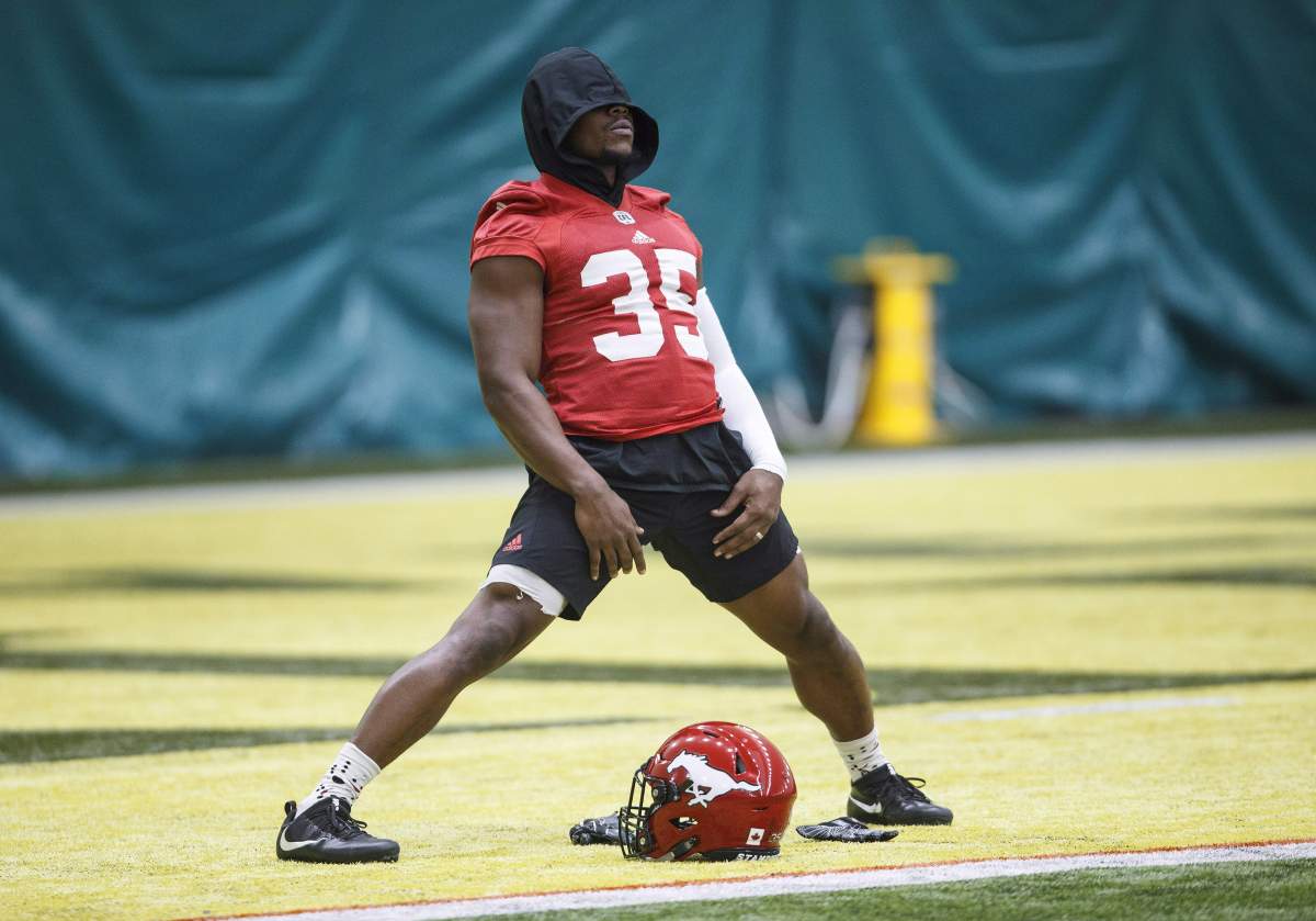 Calgary Stampeders Ka'Deem Carey (35) stretches during practice, in preparation for Grey Cup, in Edmonton, Alta., on Wednesday November 21, 2018. The Calgary Stampeders have signed running back Carey to a contract extension through the 2021 season.