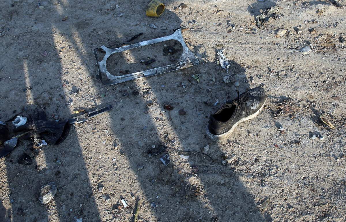 A view of victims possessions around the wreckage after an Ukraine International Airlines Boeing 737-800 carrying 176 people crashed near Imam Khomeini Airport in Tehran, killing everyone on board, in Shahriar, Iran, 08 January 2020.