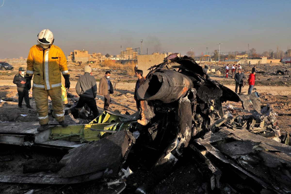 Rescue workers search the scene where a Ukrainian plane crashed in Shahedshahr, southwest of Tehran, Iran, on Jan. 8, 2020.