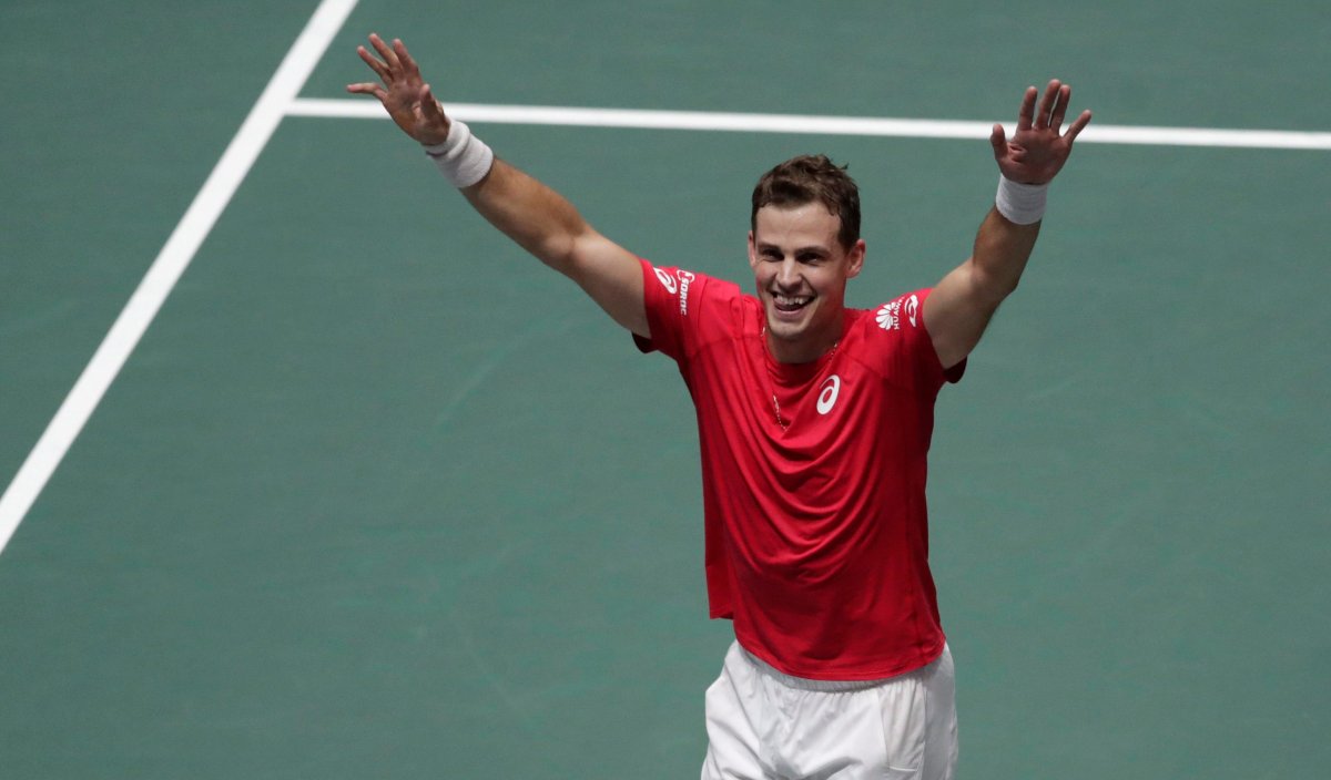 Canada's Vasek Pospisil celebrates after winning their Davis Cup semifinal doubles match with his partner Denis Shapovalov, against Russia's Karen Khachanov and Andrey Rublev, in Madrid, Spain, Saturday, Nov. 23, 2019. Pospisil has entered a Challenger tournament in Calgary. 