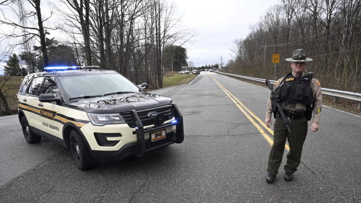 A Tennessee Highway Patrol trooper blocks the road to McGhee Tyson Air National Guard Base after reports were received of shots being fired Wednesday, Jan. 15, 2020, in Alcoa, Tenn. 
