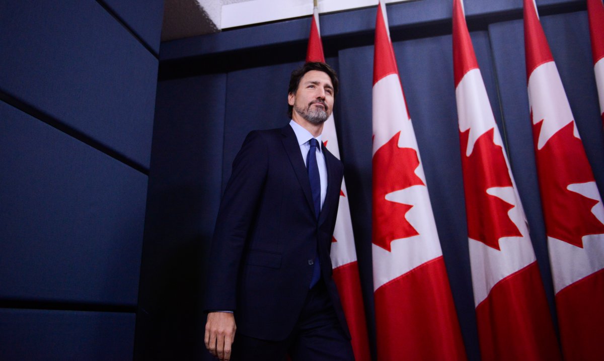 Prime Minister Justin Trudeau arrives to hold a press conference at the National Press Theatre in Ottawa on Friday, Jan. 17, 2020. 