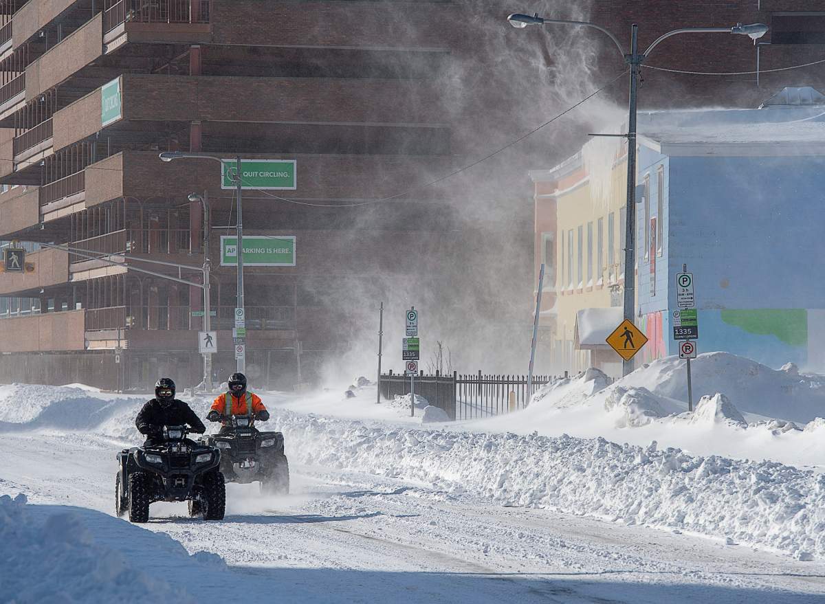 Two all-terrain vehicles cruise through downtown St. John’s on Saturday, Jan. 18, 2020. THE CANADIAN PRESS/Andrew Vaughan