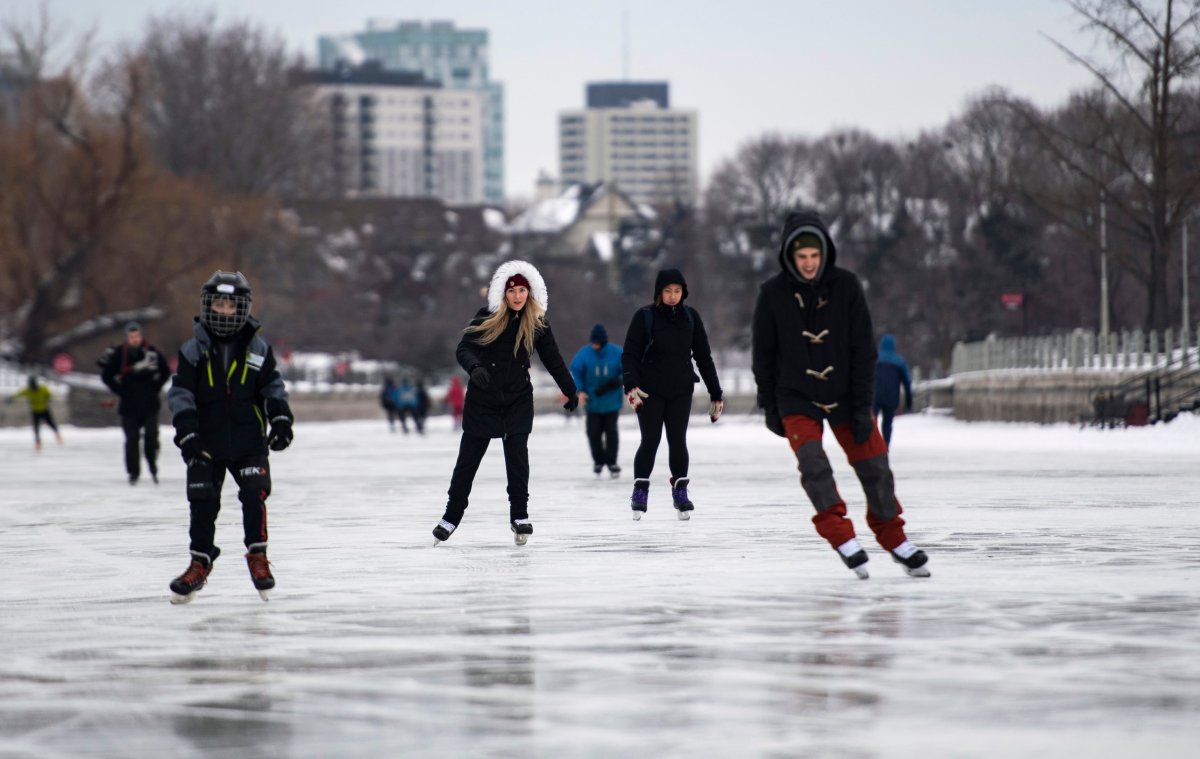 Skaters make their way along the Rideau Canal Skateway in Ottawa on the opening day of its 50th season on Saturday, Jan. 18, 2020.