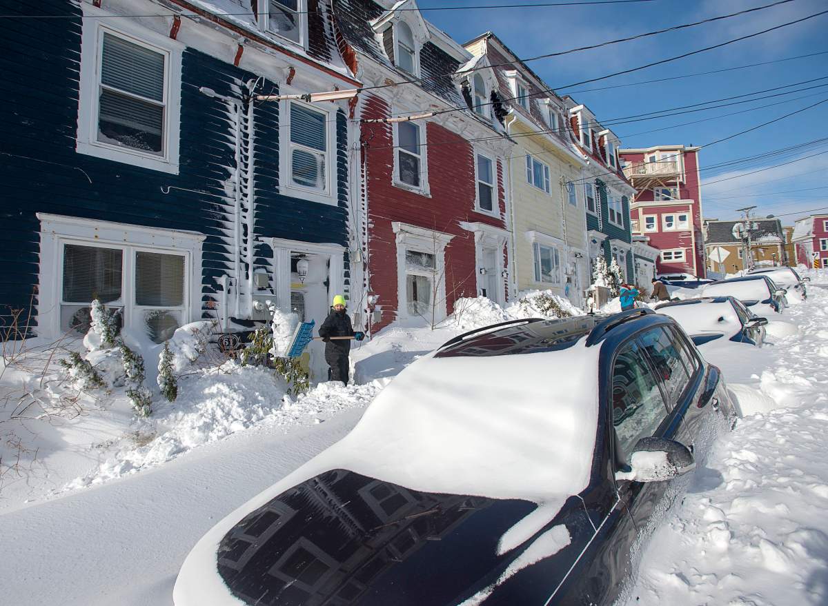 Residents dig out in St. John’s on Saturday, Jan. 18, 2020. THE CANADIAN PRESS/Andrew Vaughan