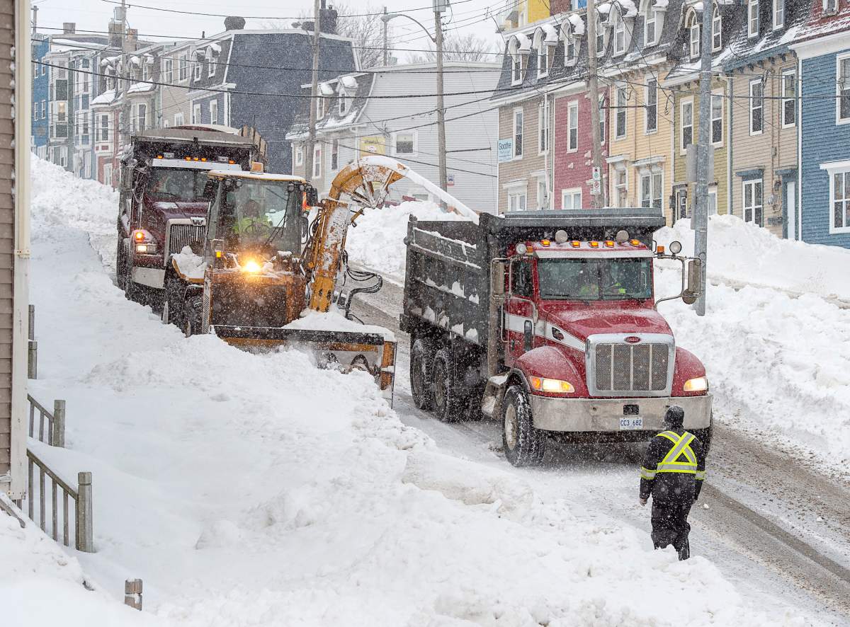 Workers continue to remove snow from the streets in St. John’s on Tuesday, January 21, 2020. THE CANADIAN PRESS/Andrew Vaughan