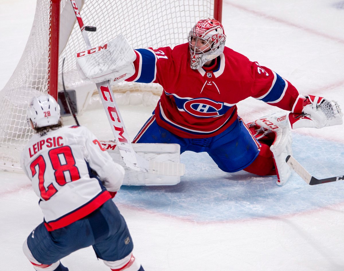 Montreal Canadiens goaltender Carey Price (31) makes the save on Washington Capitals left wing Brendan Leipsic (28) during second period NHL hockey action Monday, Jan. 27, 2020 in Montreal.