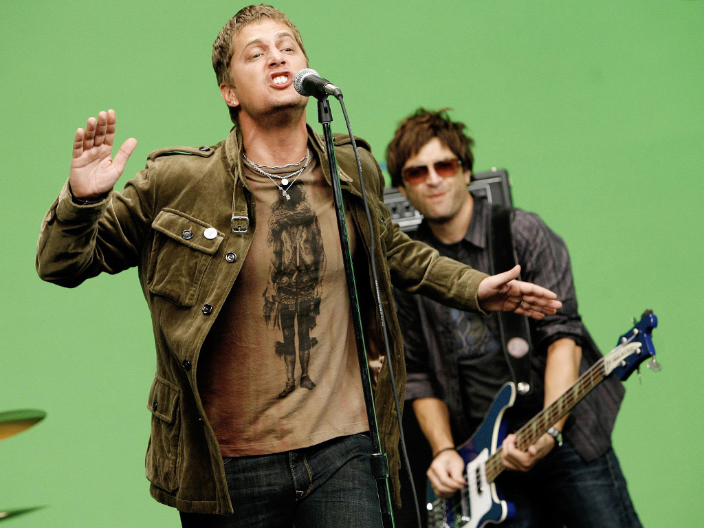 Rob Thomas, left, and Brian Yale of the band Matchbox Twenty perform during a video shoot in Los Angeles in this Aug. 8, 2007, file photo.
