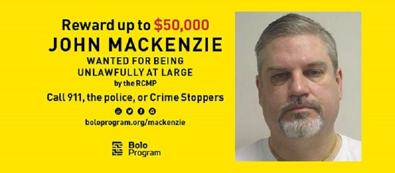 John Norman MacKenzie is now wanted on a Canada-wide warrant with a $50,000 reward.