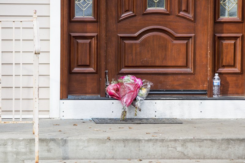 Flower bouquets rest on the doorstep of a rabbi's residence in Monsey, N.Y., Sunday, Dec. 29, 2019, following a stabbing Saturday night during a Hanukkah celebration. 