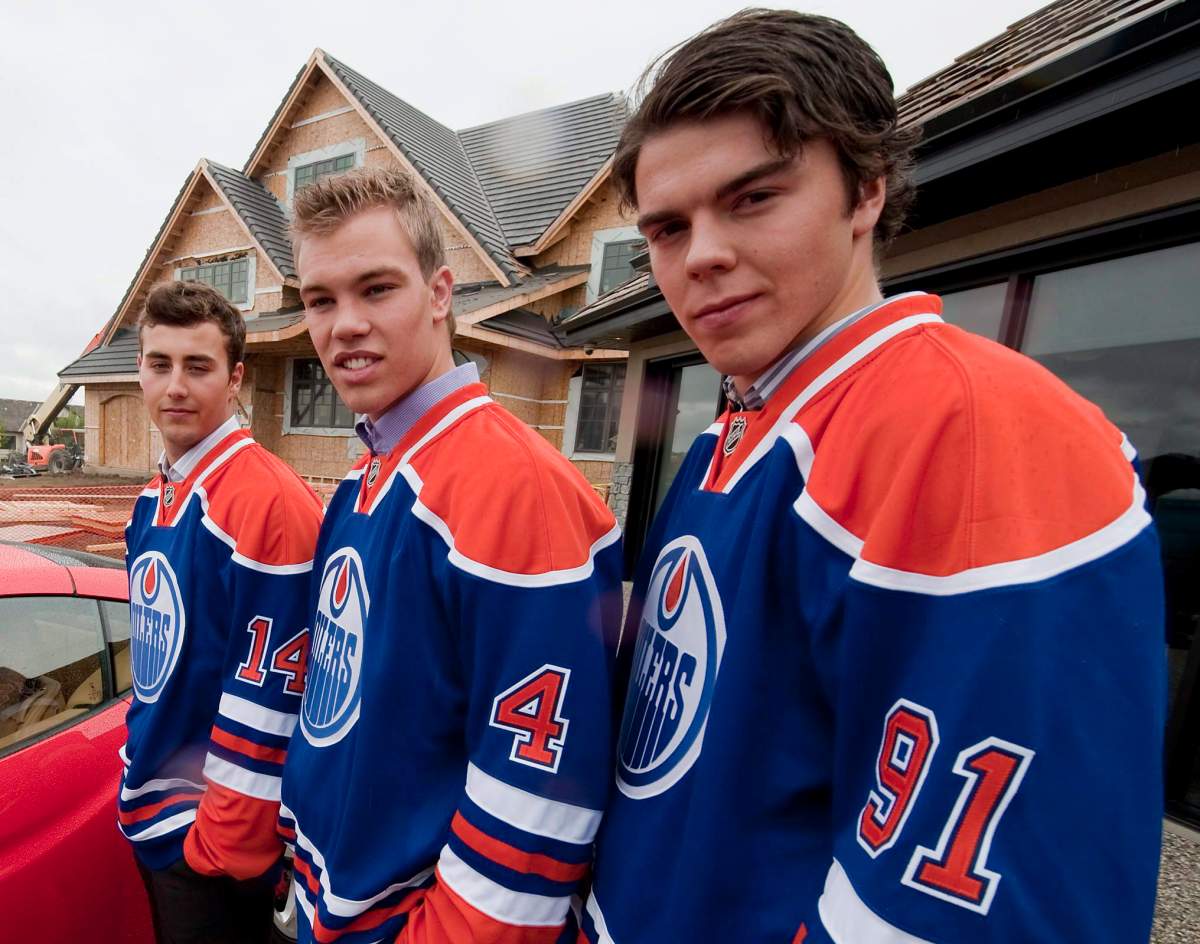 Jordan Eberle, left, Taylor Hall, centre, and Magnus Paajarvi pose in front of a show home. Hall isn’t the only Edmonton Oiler with a spotlight on him at the Young Stars Tournament. CANADIAN PRESS/John Ulan