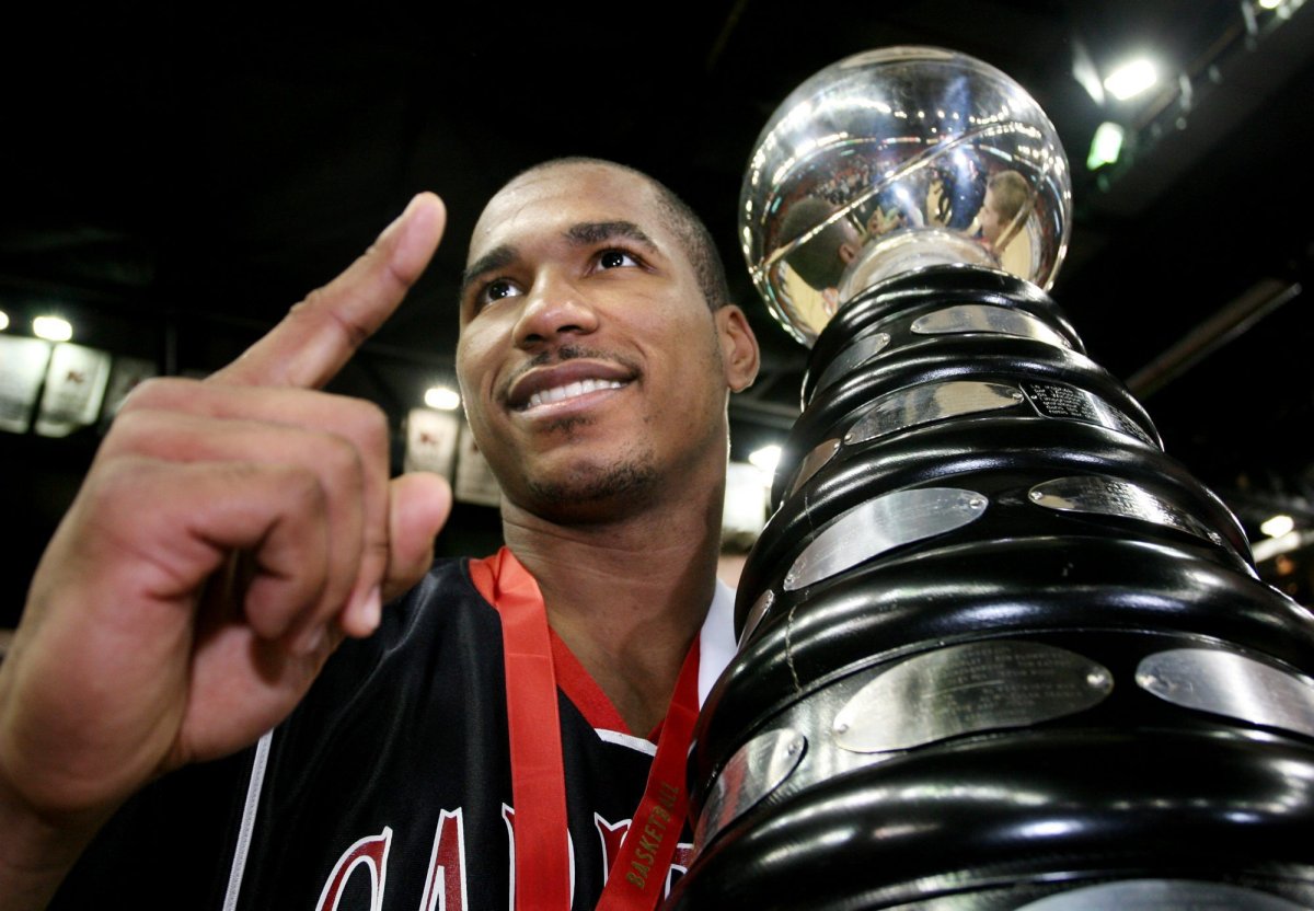 Carleton Ravens' MVP Osvaldo Jeanty, poses with the CIS basketball championship trophy at the Halifax Metro Centre on Sunday, March 19, 2006. Jeanty has been hired as the Ottawa BlackJacks' first head coach.