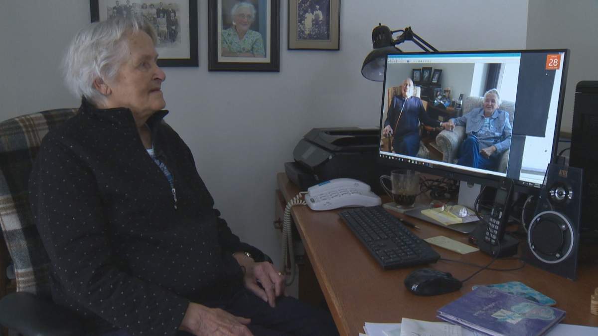 Donna Baldwin looks at a photo of her husband, Kelvin, who had a medically assisted death in November after struggling with COPD.