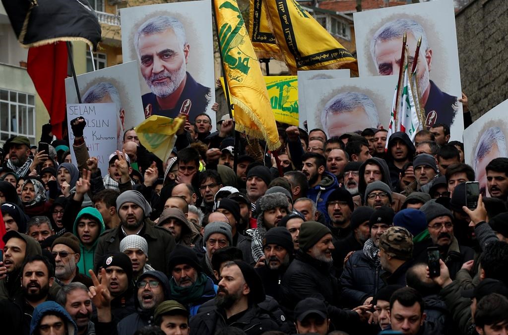 Protesters chant anti-U.S. slogans during a demonstration against the killing of Iranian Revolutionary Guard Gen. Qassem Soleimani, close to United States' consulate in Istanbul, Sunday, Jan. 5, 2020. Iran has vowed "harsh retaliation" for the U.S. airstrike near Baghdad's airport that killed Soleimani, Tehran's top general and the architect of its interventions across the Middle East, as tensions soar in the wake of the targeted killing. (AP Photo/Lefteris Pitarakis).
