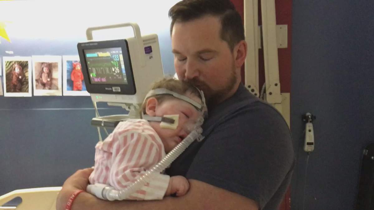 Ryan Fengstad, with 10-month-old Reign.