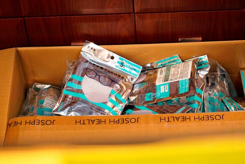 A box of masks imported from Japan sits inside a Yifeng Pharmacy in Wuhan, China, January 22, 2020.