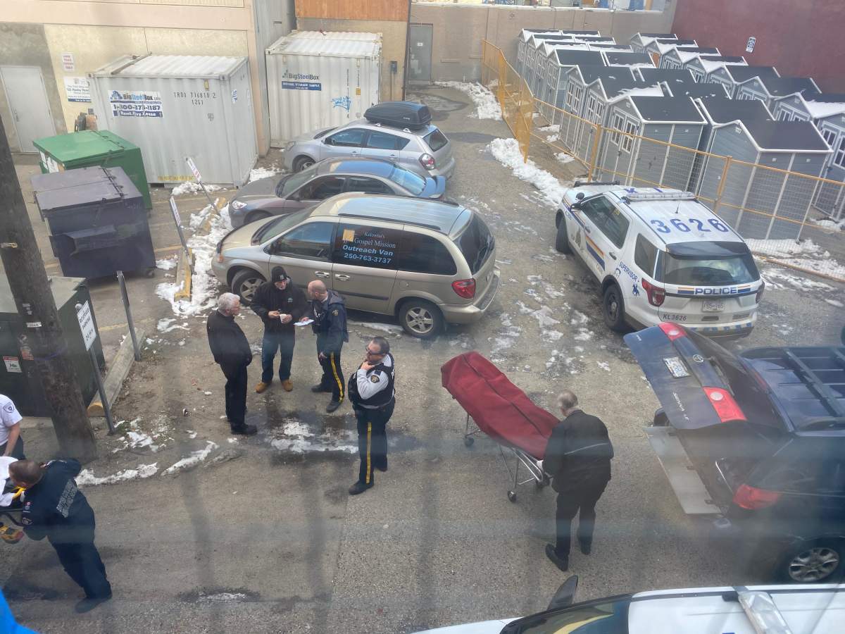 Police and ambulance paramedics respond to an alley in the 200-block of Leon Avenue Thursday morning where a body was discovered.