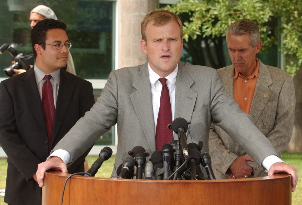 District Attorney Mark Hurlbert announces that sexual assault charges have been filed against Los Angeles Lakers basketball star Kobe Bryant, at the Eagle County Justice Center in Eagle, Colo., Friday, July 18, 2003.
