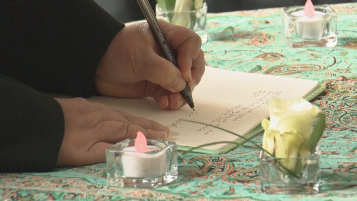 A lineup formed for the book of condolences at the University of Calgary vigil on Sunday, Jan. 12, 2020.