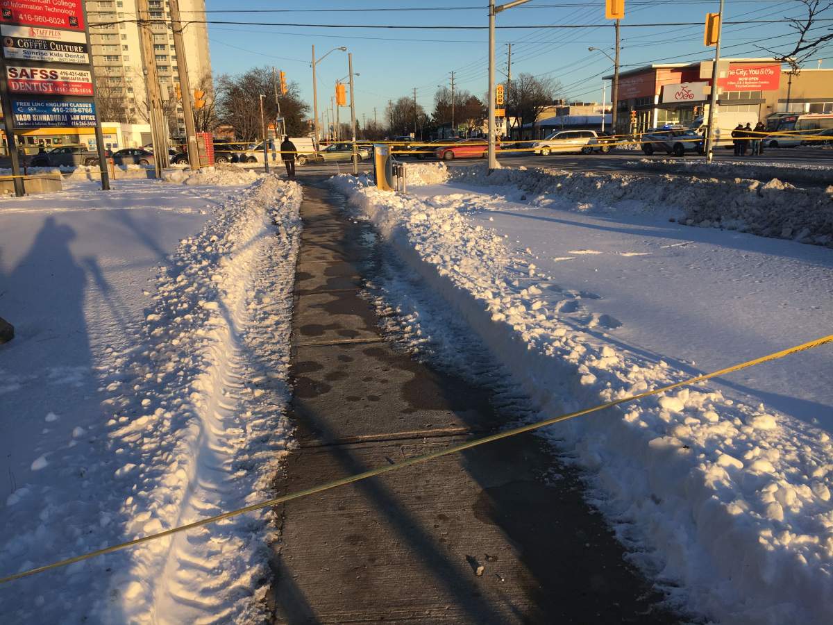 Police block off a sidewalk after a shooting near Markham and Ellesmere roads.