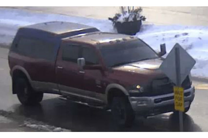 The vehicle is described as a Dodge Ram 3500 Diesel with a dark blue truck cap and an upper mounted rear-brake light, officers say.
