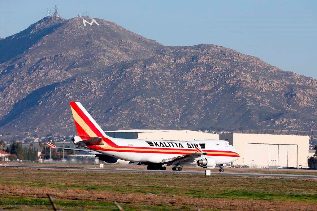 An airplane carrying U.S. citizens being evacuated from Wuhan, China, takes off at March Air Reserve Base in Riverside, Calif. Jan. 29, 2020. The passengers will undergo additional screenings in California and be placed in temporary housing. Officials have not said how long they will stay there.