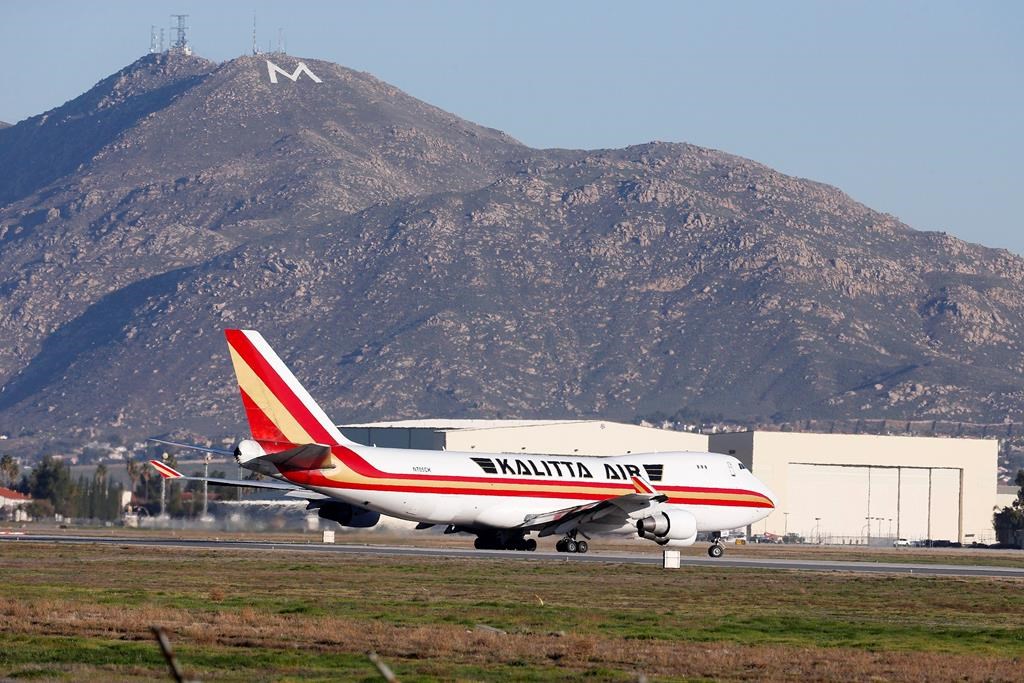 An airplane carrying U.S. citizens being evacuated from Wuhan, China, takes off at March Air Reserve Base in Riverside, Calif. Jan. 29, 2020. The passengers will undergo additional screenings in California and be placed in temporary housing. Officials have not said how long they will stay there.