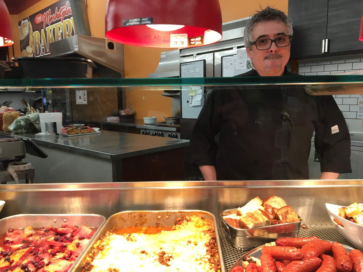 Tony Frias is one of two chefs at an independent grocery store.