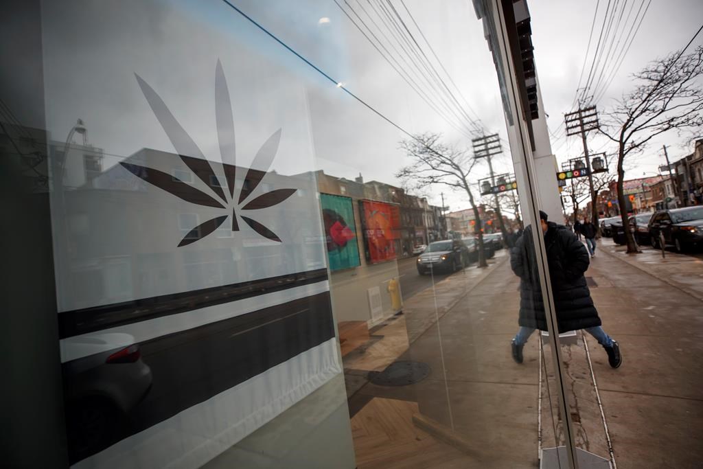 A customer walks into a Cannabis dispensary on Queen St. in Toronto, Monday, Jan. 6, 2020. THE CANADIAN PRESS/Cole Burston.