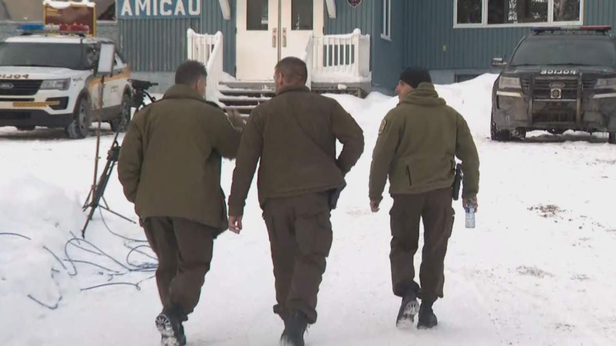Quebec provincial police canvass the area where French tourists went missing in January.