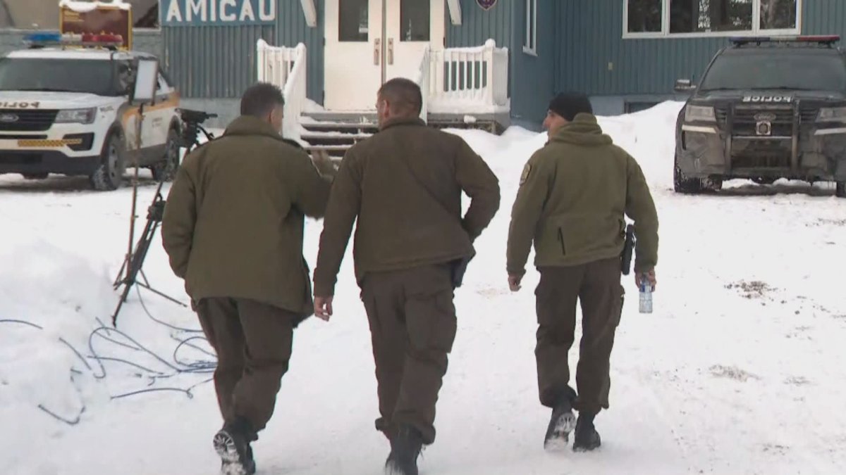 Quebec provincial police canvass the area where five French tourists remain missing.