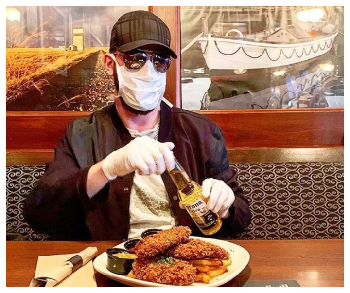 A man wears a surgical mask in an Instagram post tagged at Hudsons Canada’s Pub in Saskatoon, Sask., on Jan. 31, 2020.