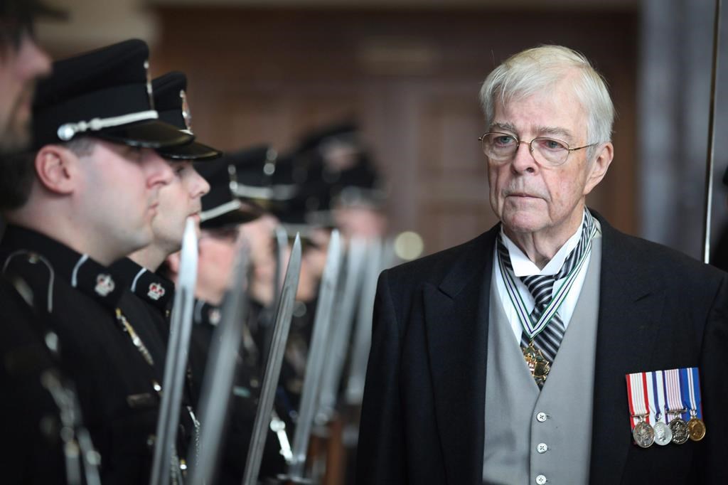 Newfoundland and Labrador Lieutenant Governor John Crosbie inspects the Royal Newfoundland Constabulary as he enters the House of Assembly to deliver the throne speech in St.John's, Monday, March 21, 2011.